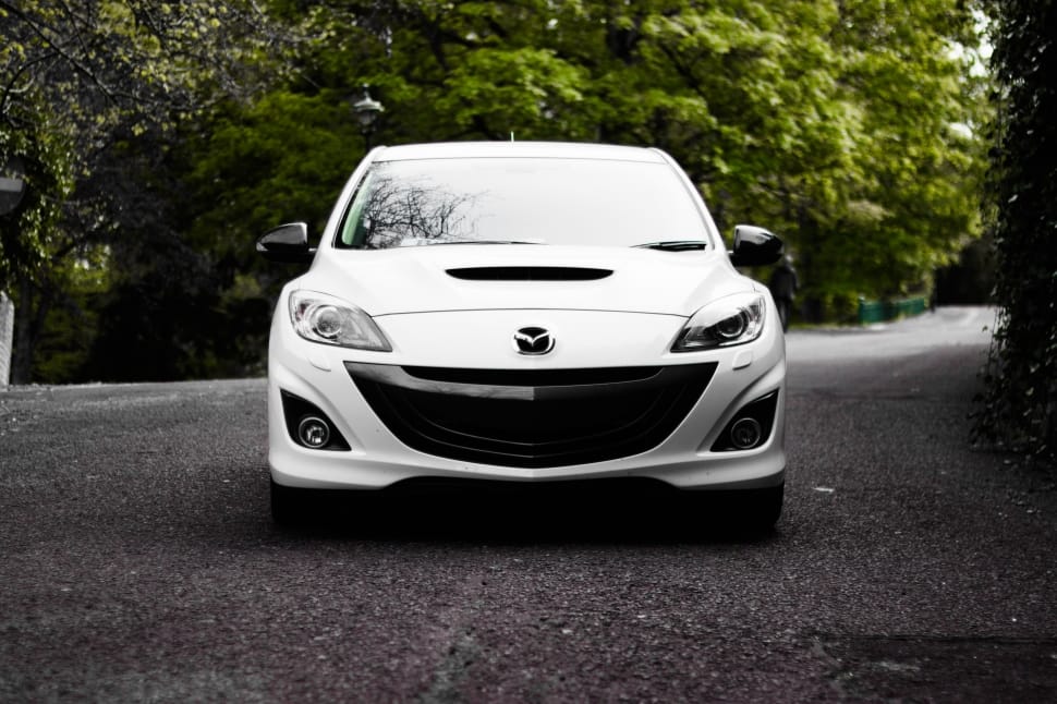 showing white mazda car preview