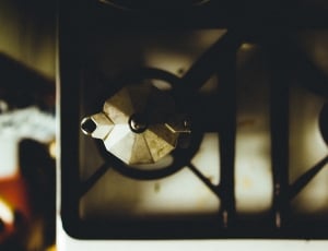 stainless steel kettle on top of gas stove thumbnail