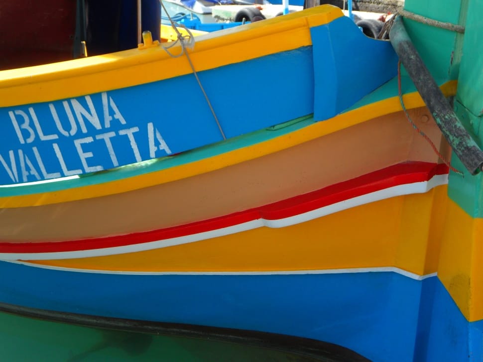 blue yellow red and brown boat preview