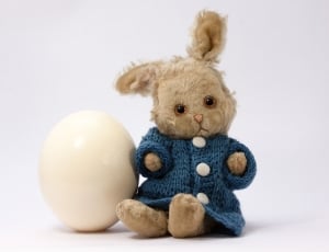 brown rabbit plush toybesides white egg thumbnail