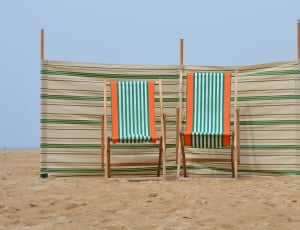 2 green and orange deck chairs thumbnail