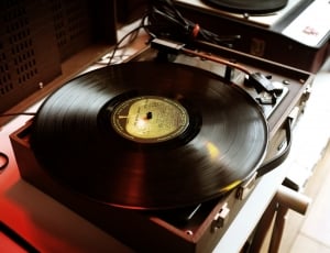 black vinyl record on vinyl record player thumbnail