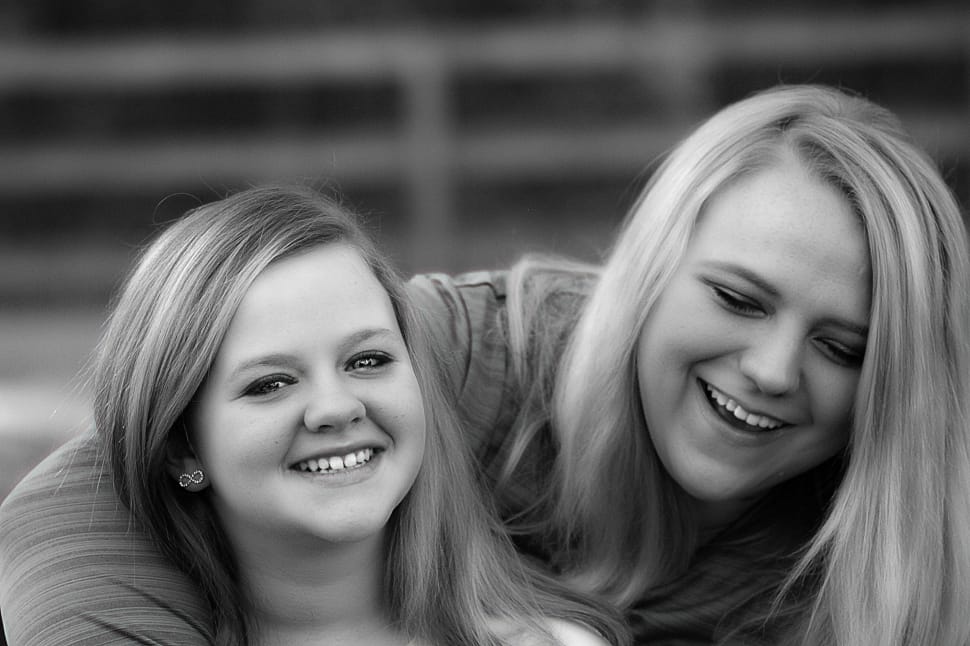 2 women grayscale photo preview