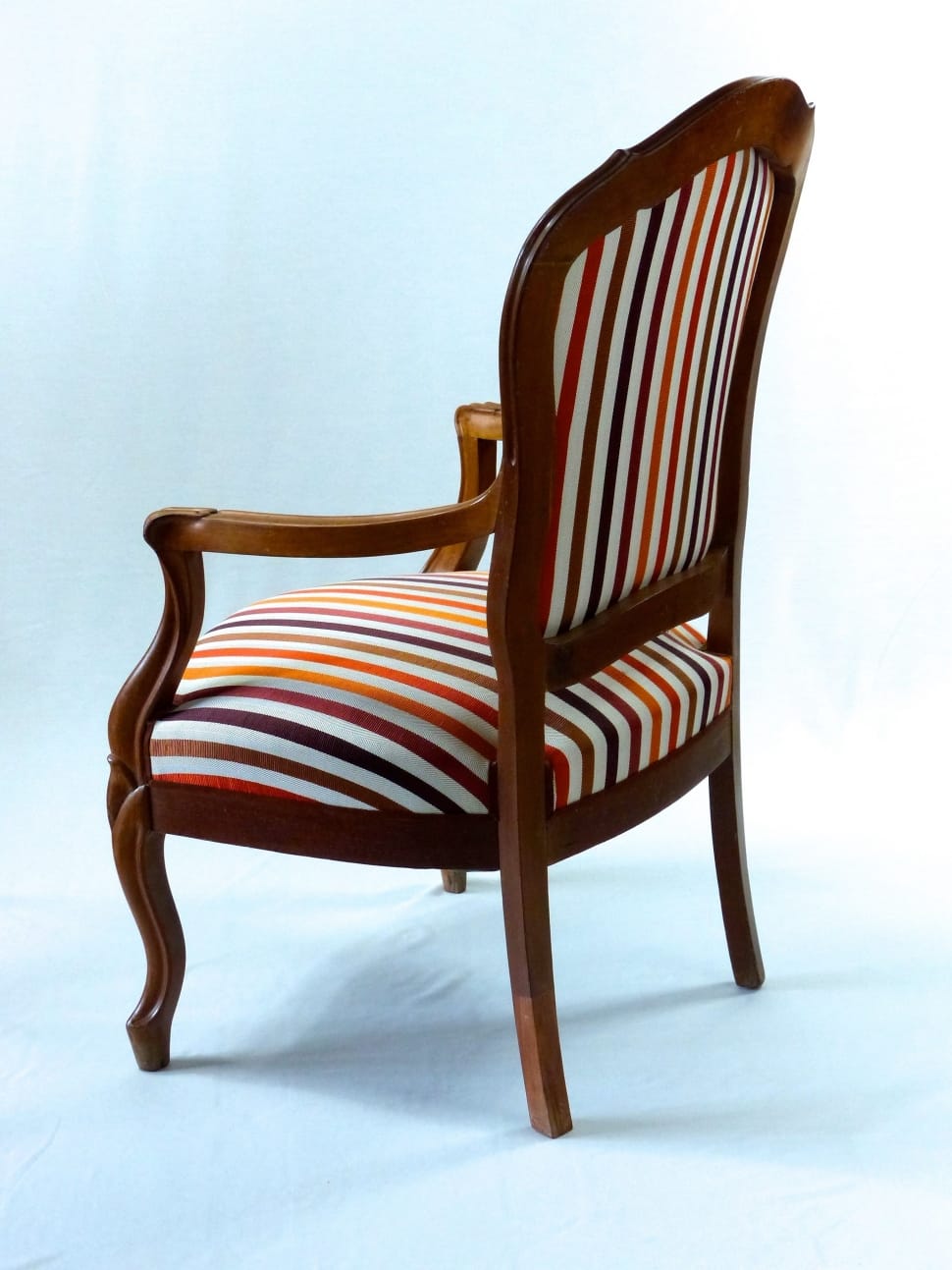 brown wooden framed white red and blue stripped armchair preview