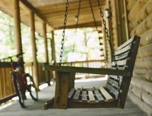 beige wooden swing bench thumbnail