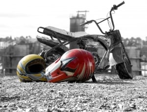 2 motocross helmets and minibike thumbnail