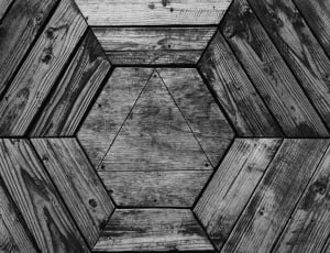 gray and black wooden hexagonal carved surface thumbnail