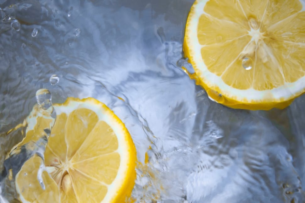 clear water with two lemon garnishes preview