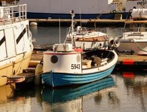 blue and white boat thumbnail
