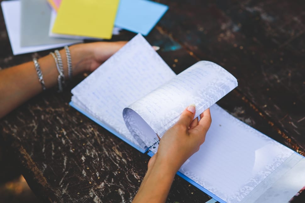 person holding while scanning notes preview