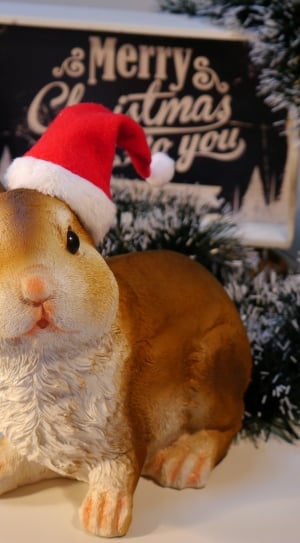 rabbit wearing santa hat figurine thumbnail