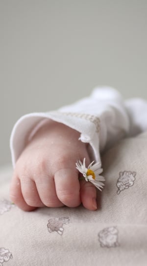 infant white long sleeve shirt and white flower thumbnail