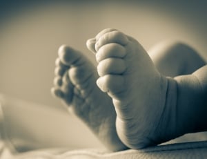 sepia photograph of a baby's foot thumbnail