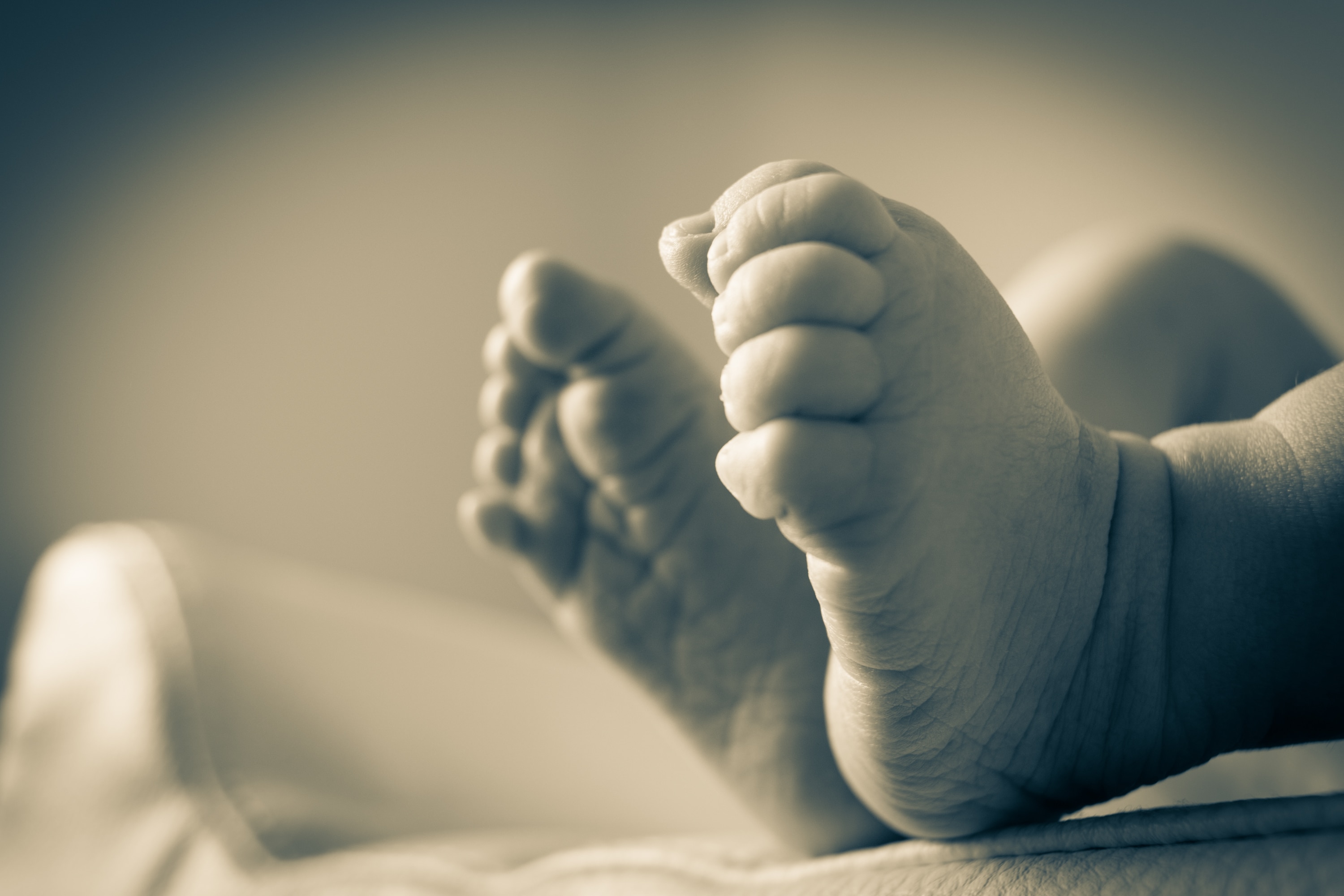 sepia photograph of a baby's foot