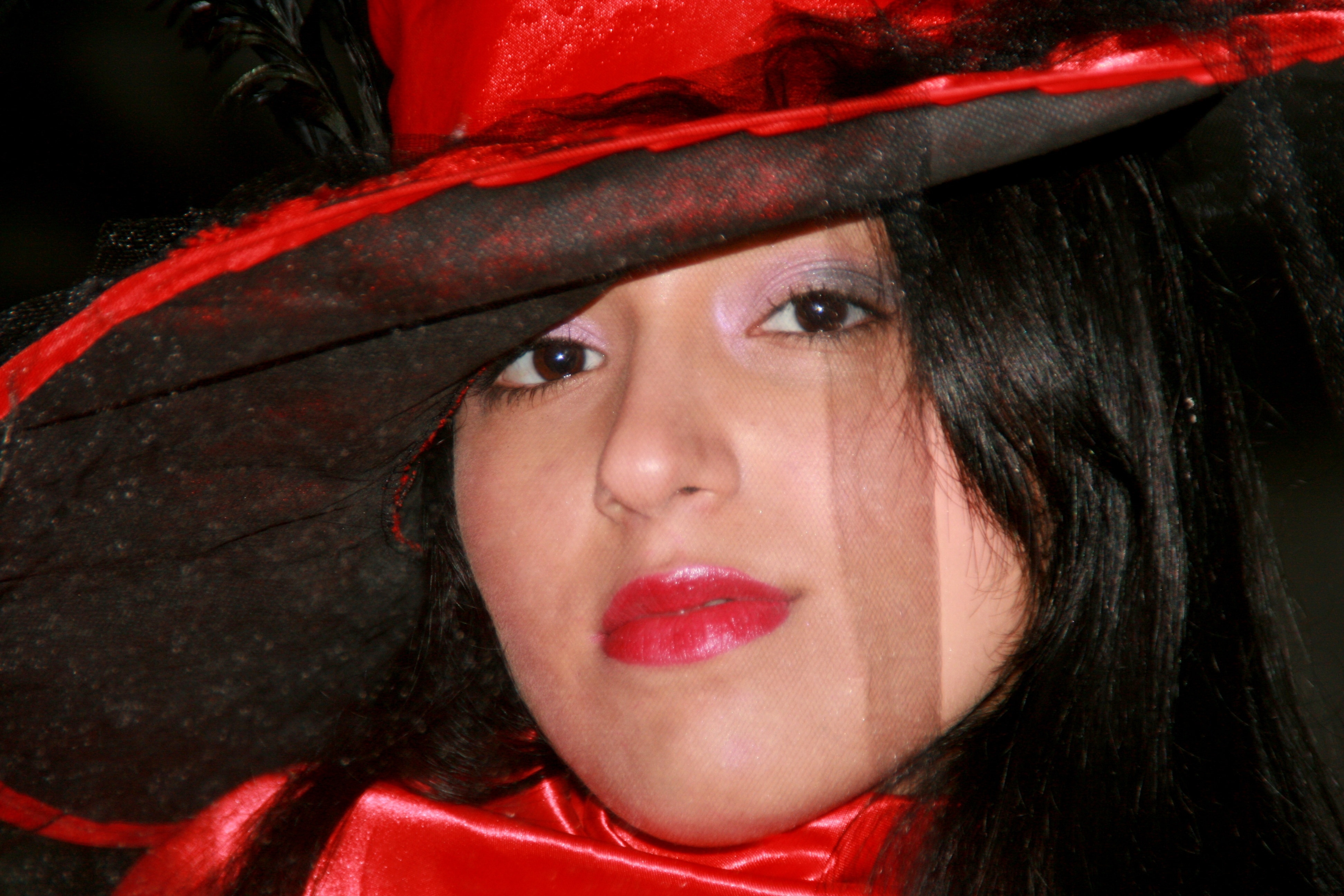 woman wearing red and black hat