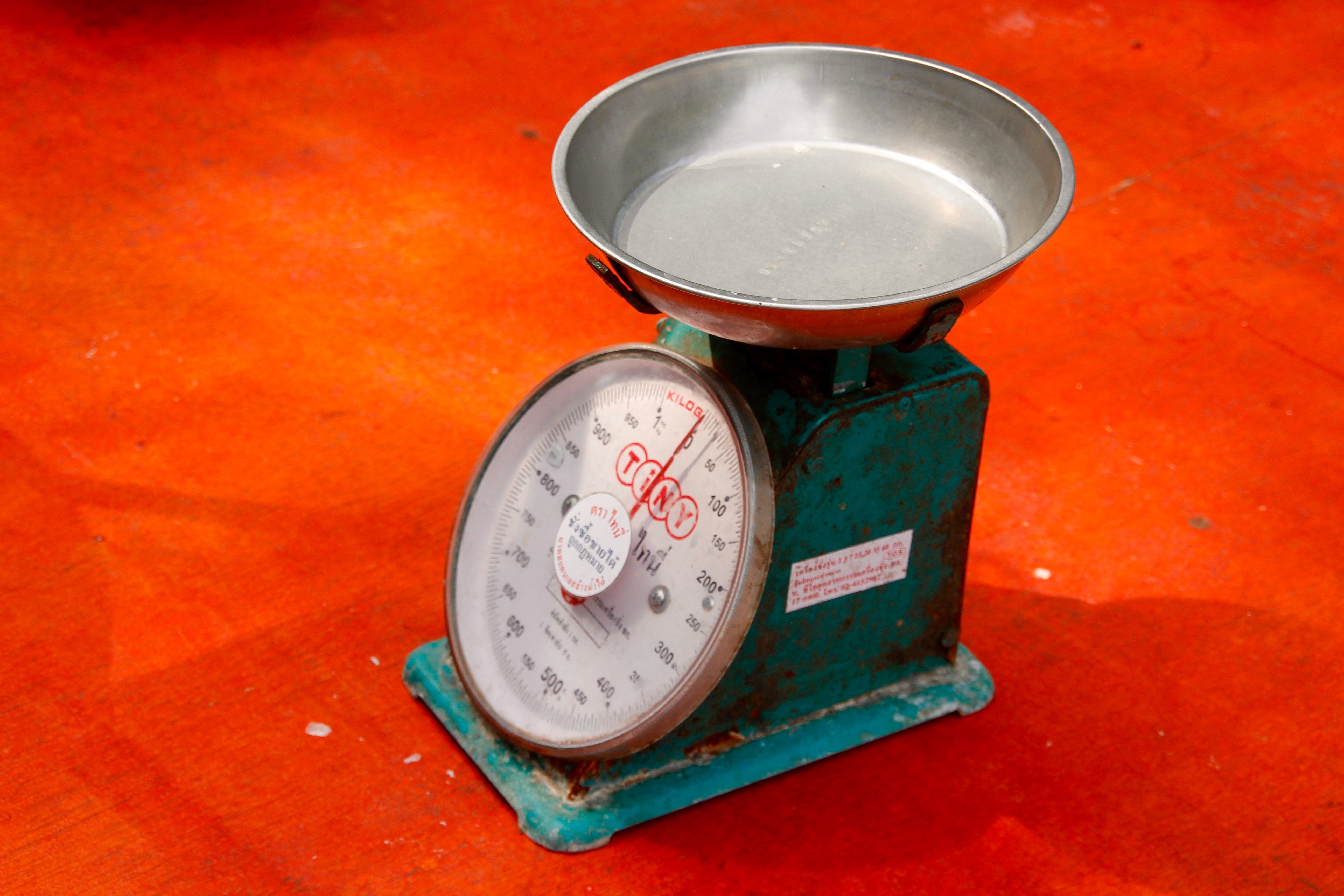 grey and green weighing scale