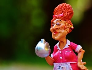 photography of female in pink and white dress holding teapot figurine thumbnail
