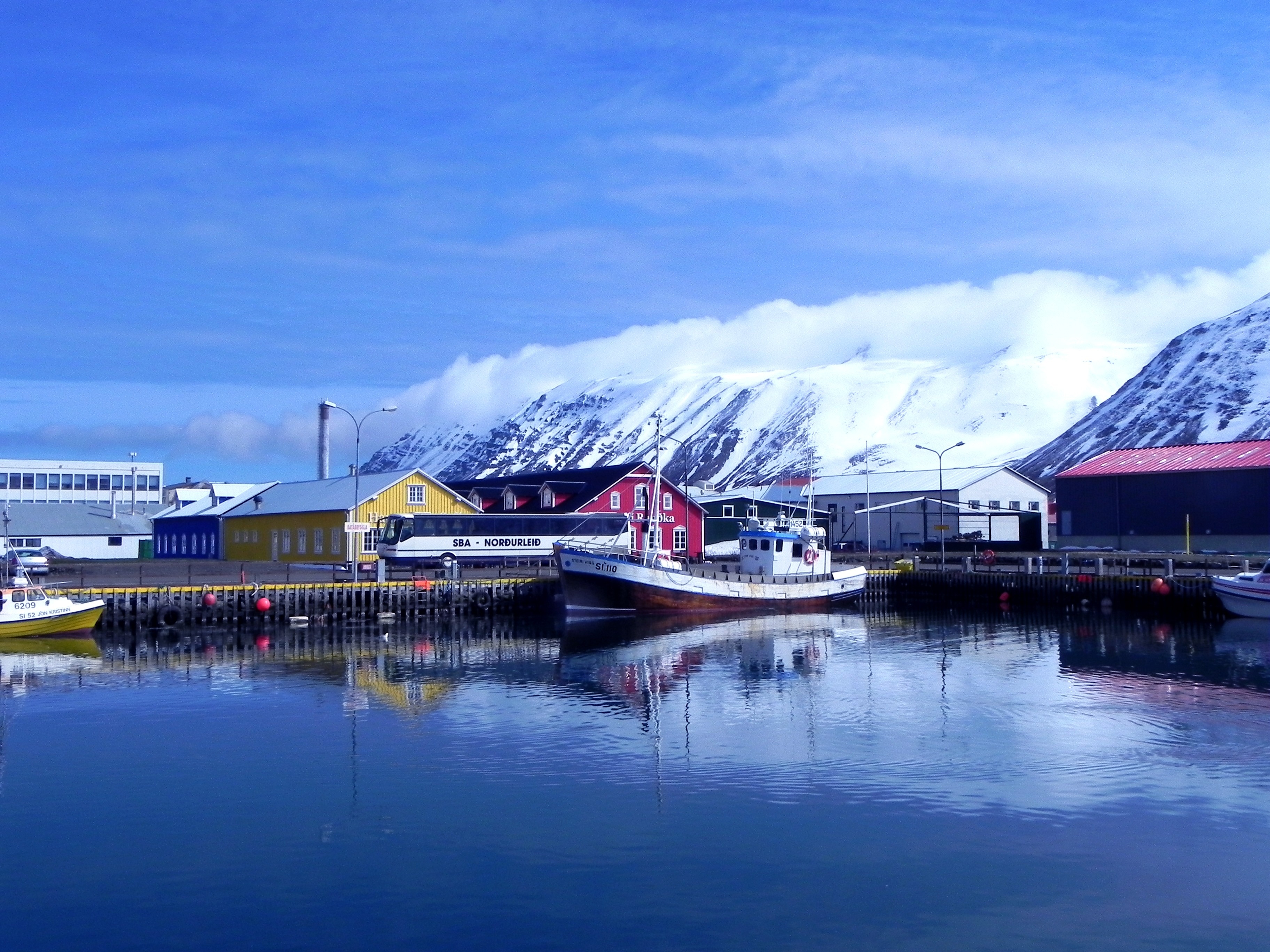 photo of brown mountains and sea