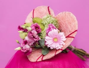 assorted flower on red textile with pink background thumbnail