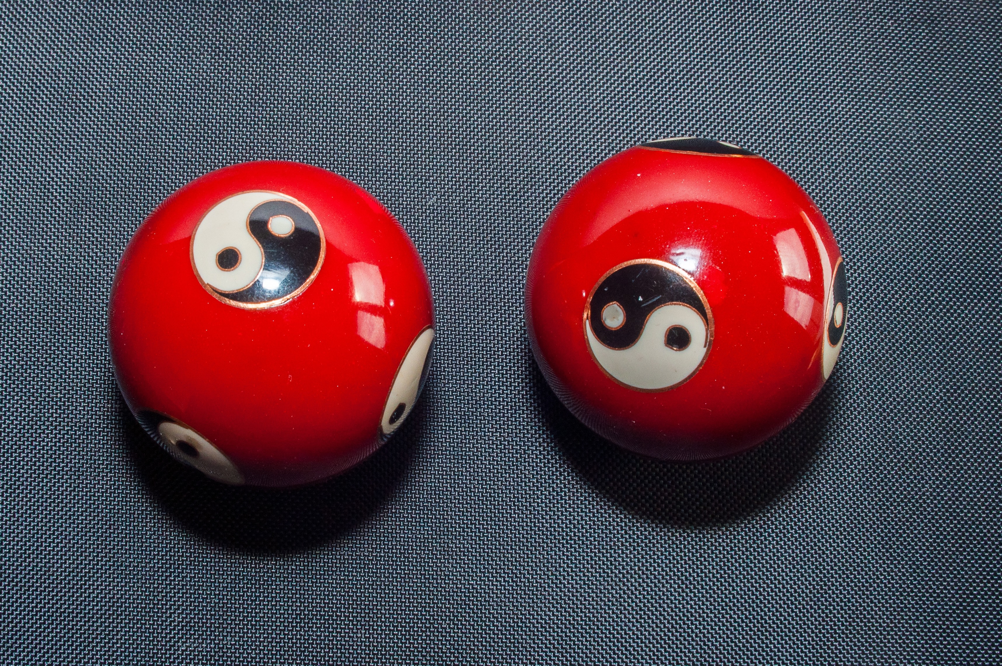 two yin yang print balls
