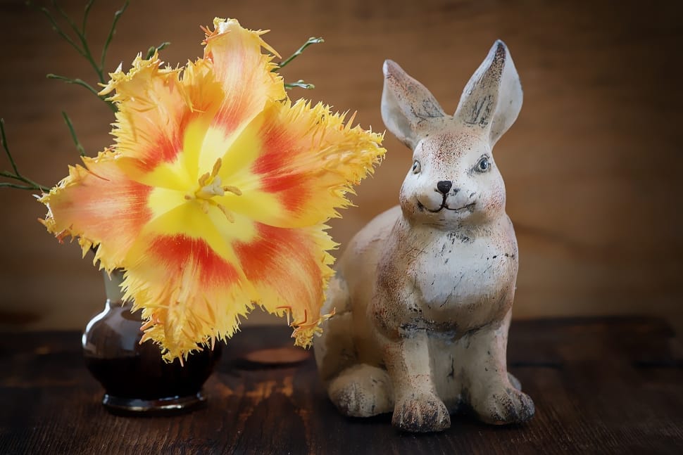 yellow petaled flower and grey rabbit ceramic figurine decors preview