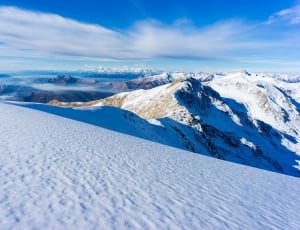 photography of mountains covered with snow thumbnail