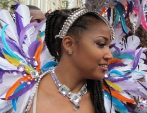 women's diamond necklace and white and purple feather head dress thumbnail