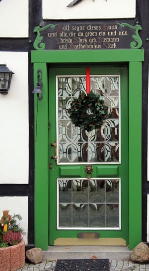 green wooden frame clear glass storm door with mistletoe wreath thumbnail