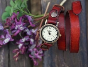 red leather strap silver round frame analog watch thumbnail