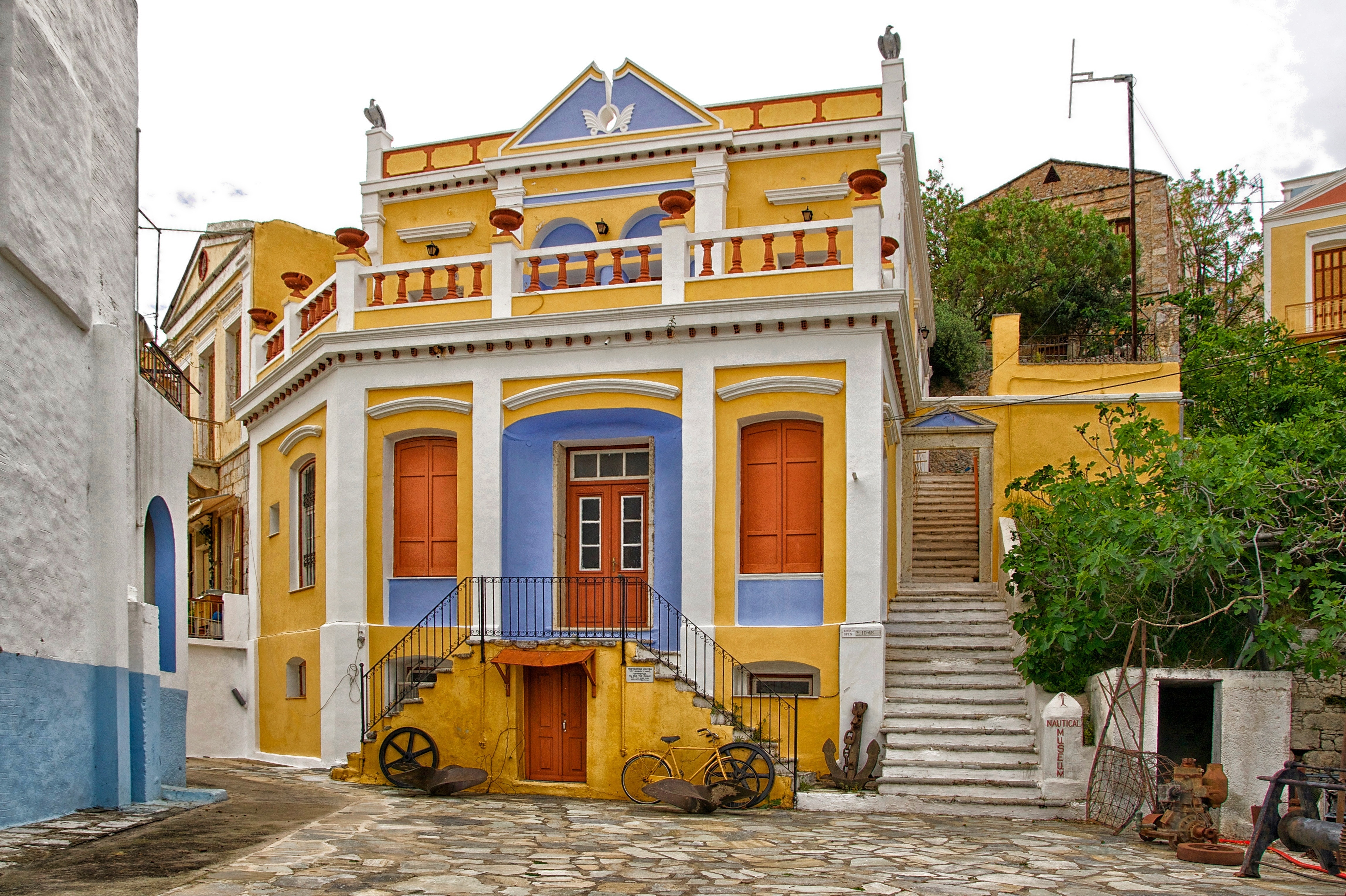 yellow white and blue painted house