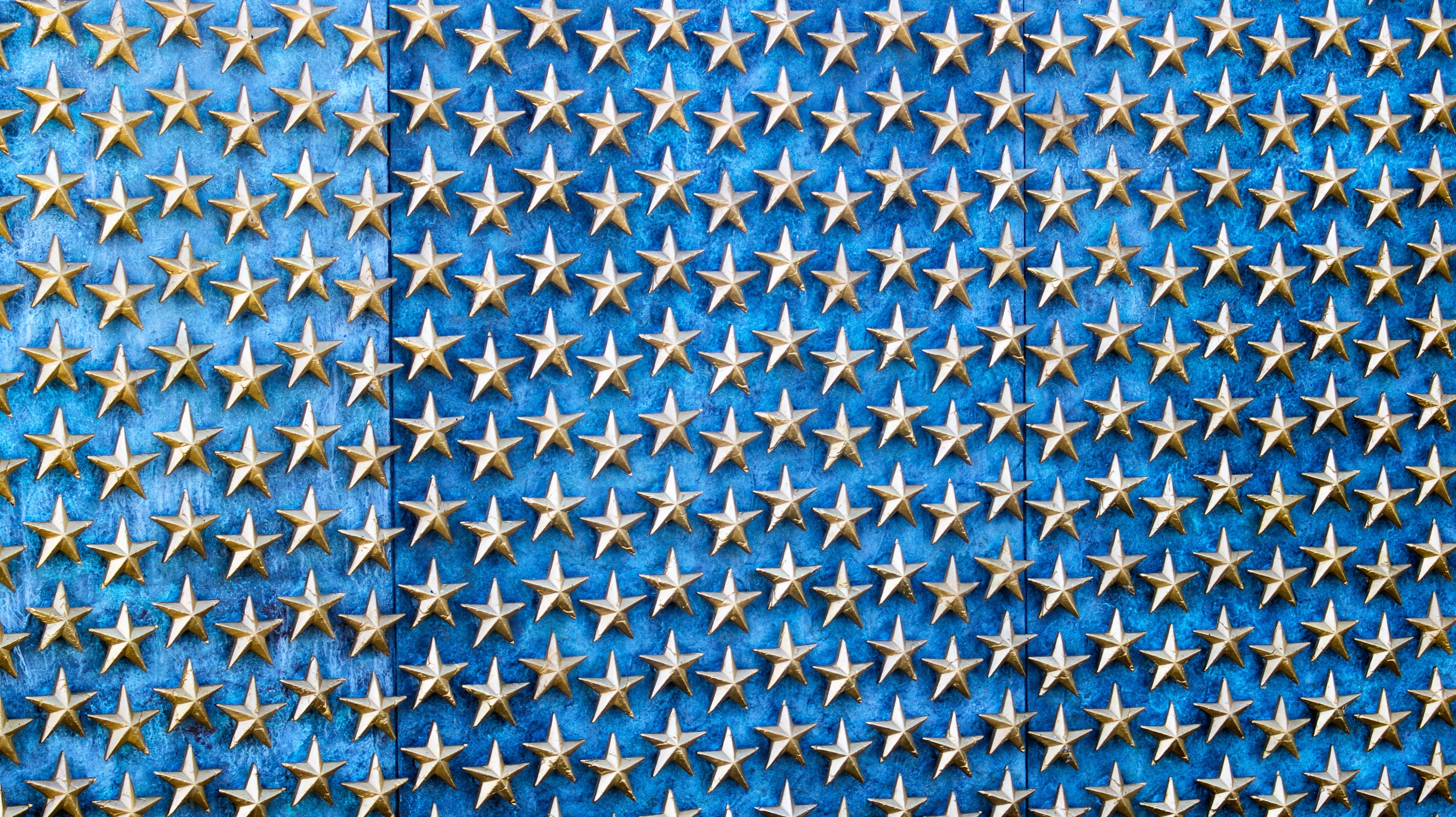 grey metal stars on blue wooden wall