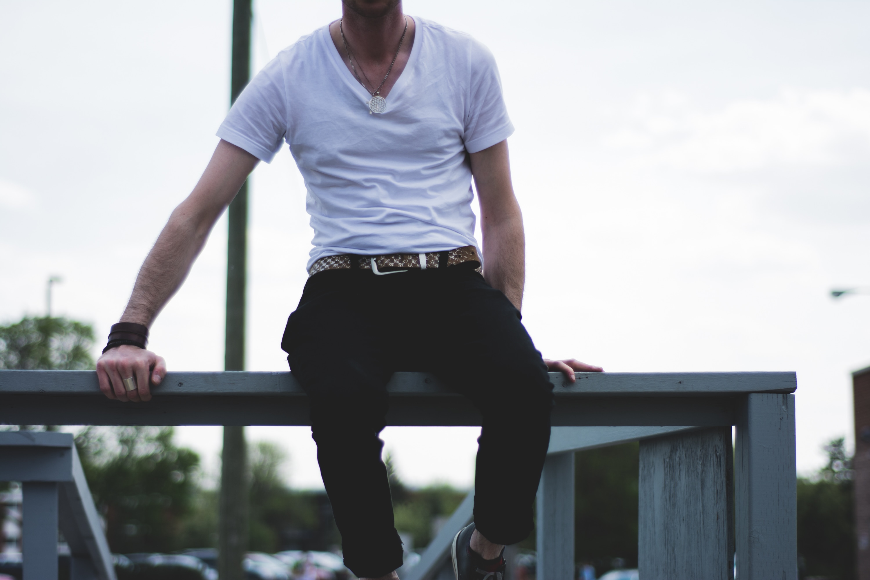Handsome, Attractive Guy, Standing Leaning on the Railing in a White T-shirt,  Black, Leather Jacket, Black Pants and White Stock Photo - Image of  background, attractive: 141491506