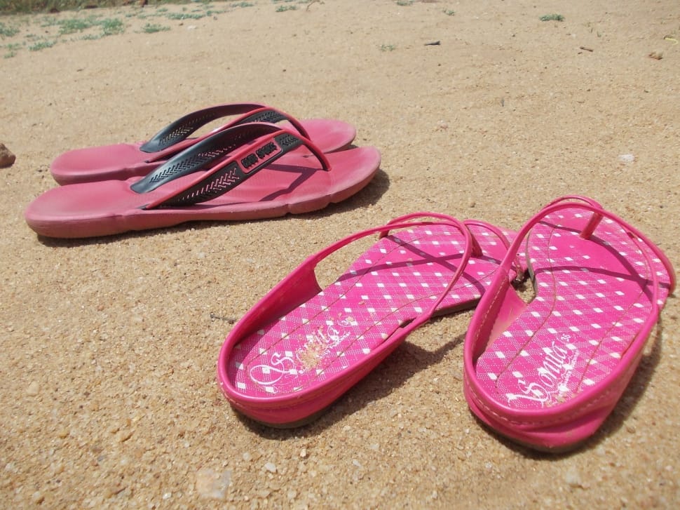 two pink and red flip flops preview