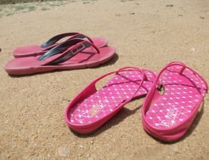 two pink and red flip flops thumbnail