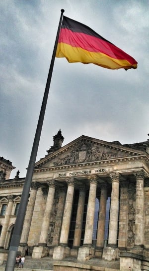 black, red and yellow flag near Dem Deutcher Volke thumbnail