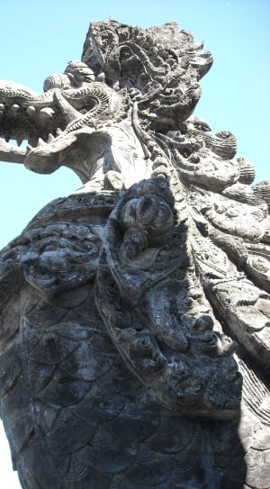 Chinese Dragon statue under clear blue sky thumbnail