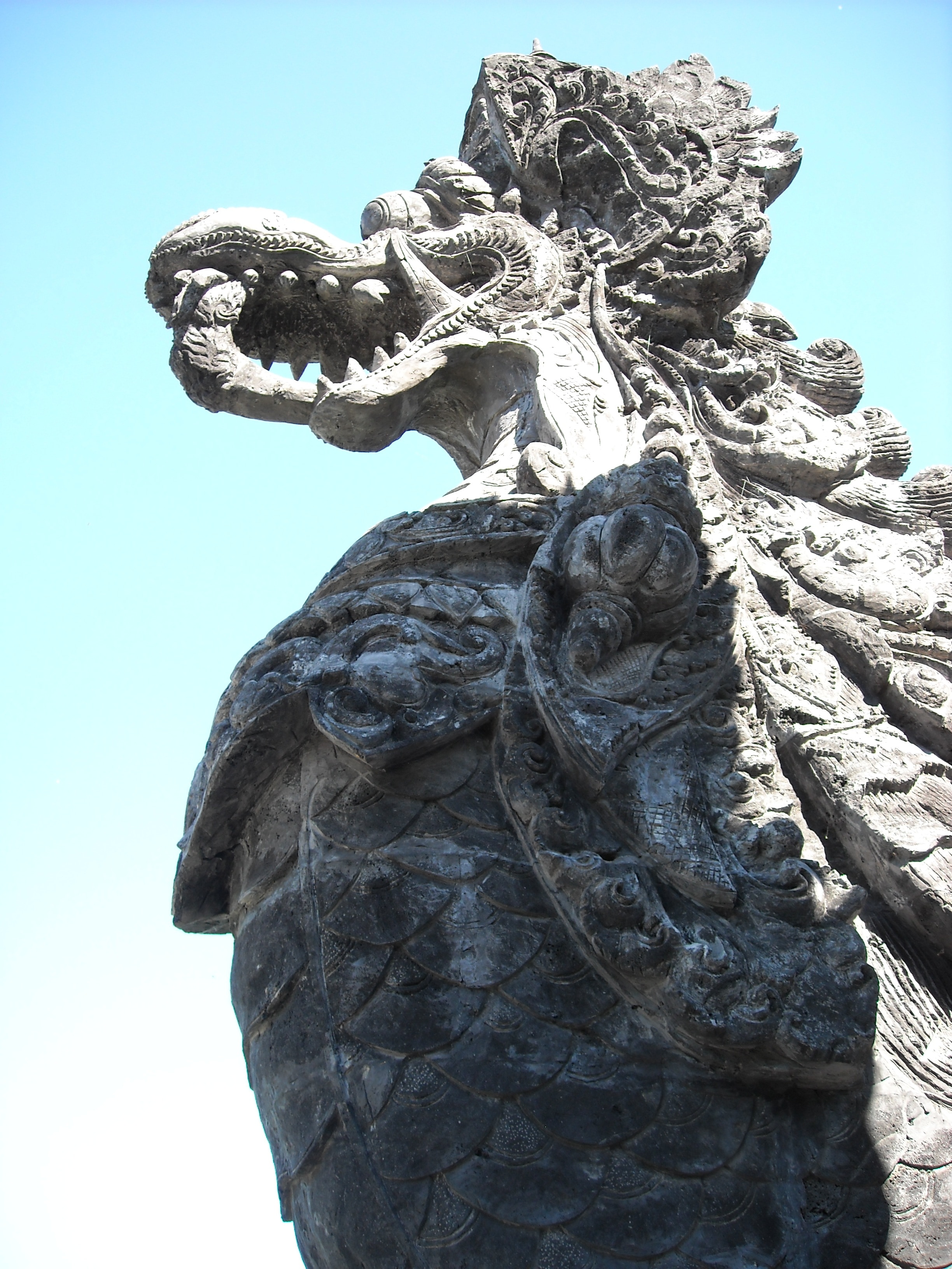 Chinese Dragon statue under clear blue sky