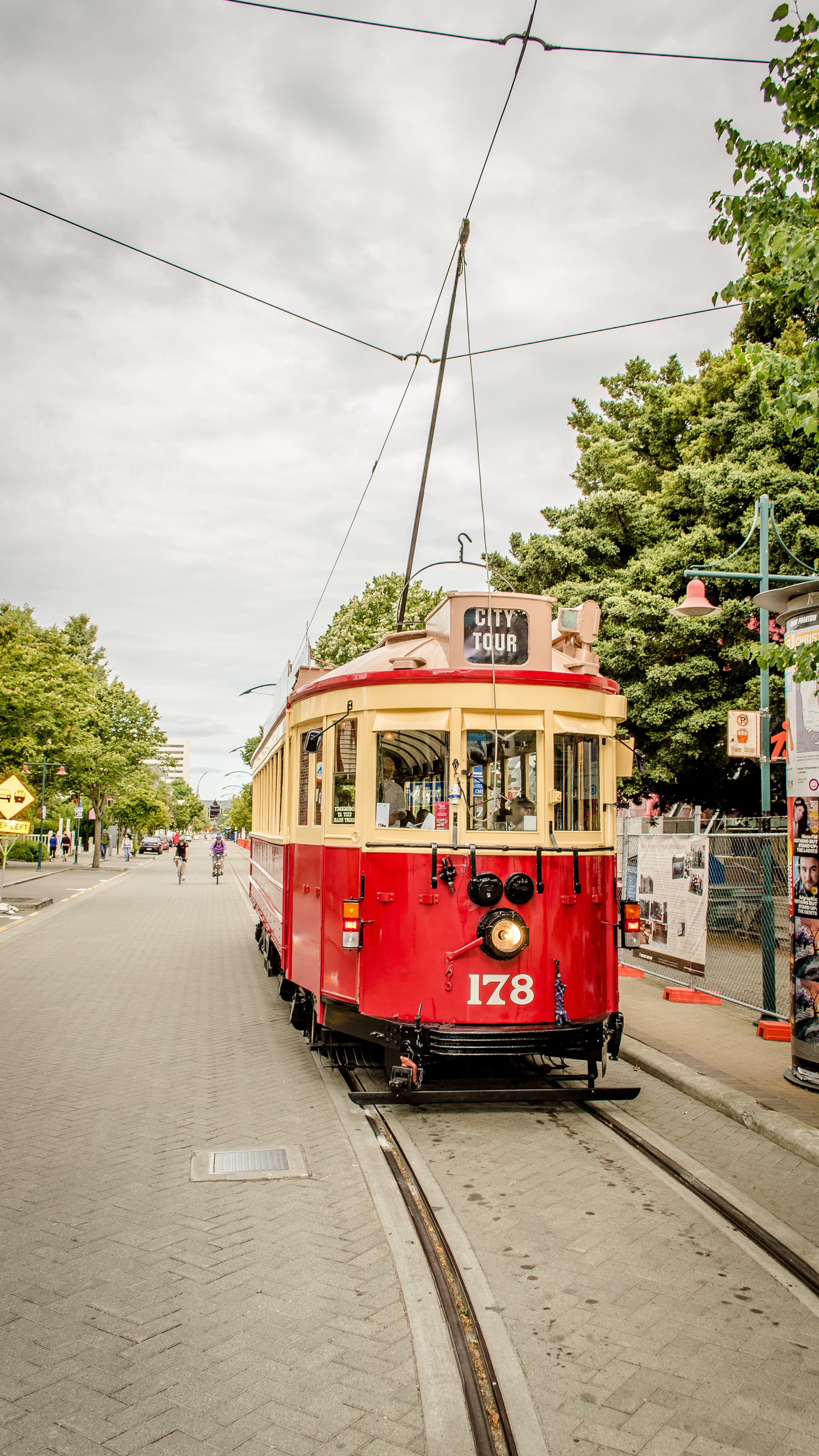 red and beige city tour train