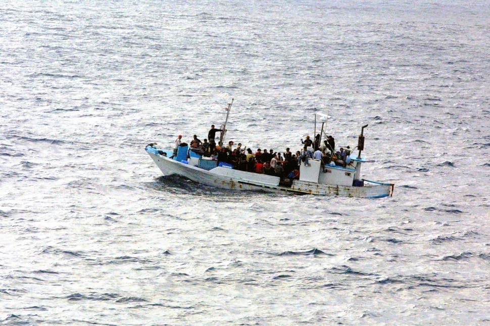 group of people riding on boat on body of water preview