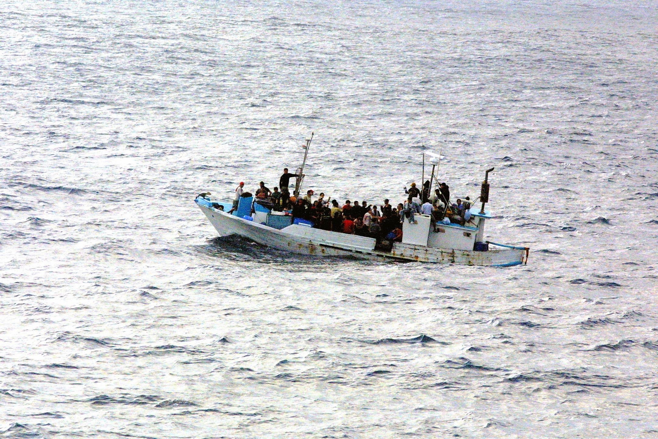 group of people riding on boat on body of water