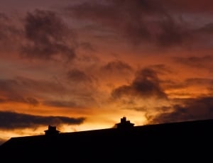 silhouette of houses during sunset thumbnail