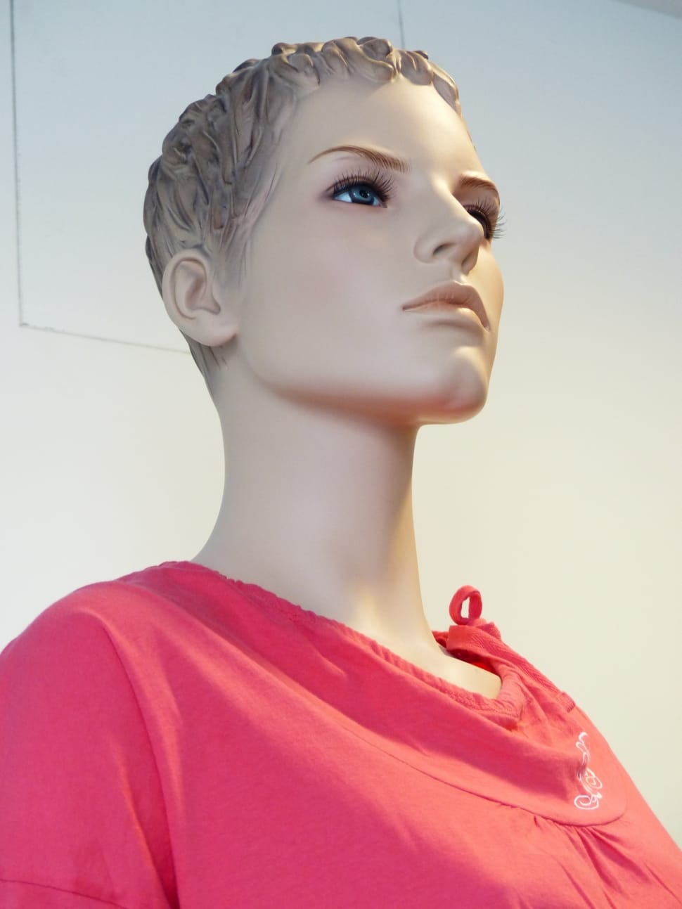 female mannequin in red shirt preview