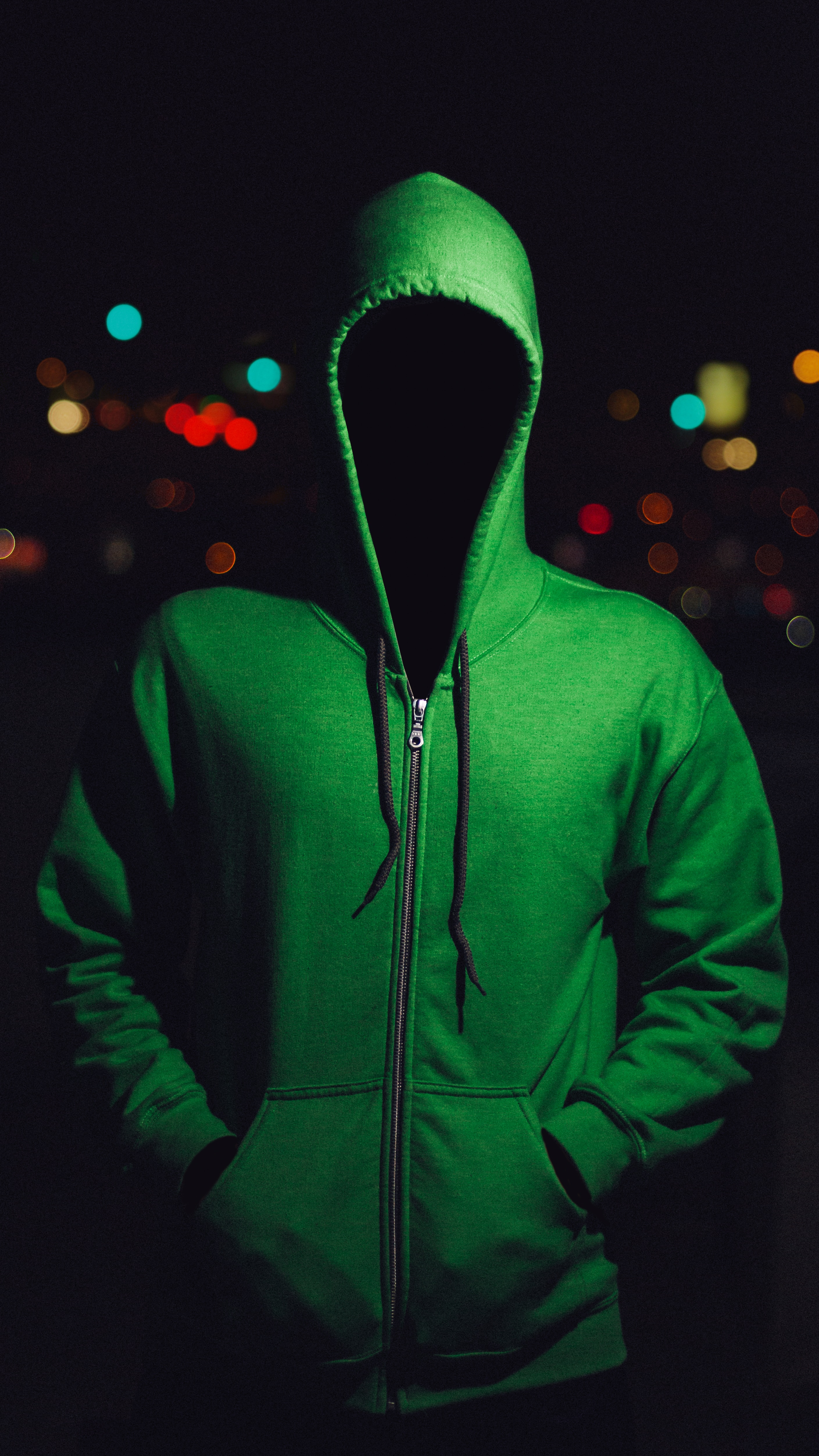 person wearing green zipped hoodie