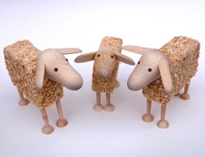 3 brown wooden sheep figurines thumbnail