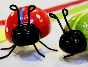 2 red and green lady bug toys thumbnail
