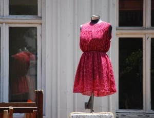 black dressform in pink sleeveless crew neck dress during daytime thumbnail