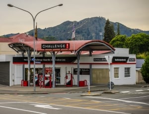 red and gray challenge gasoline station thumbnail