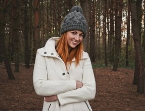 women's white coat and gray knit cap thumbnail