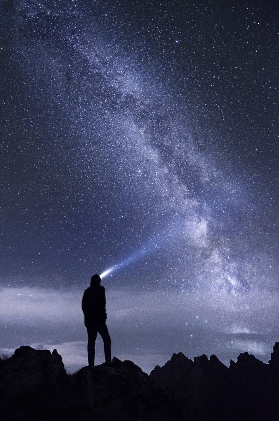 man with headlight watching sky photo preview