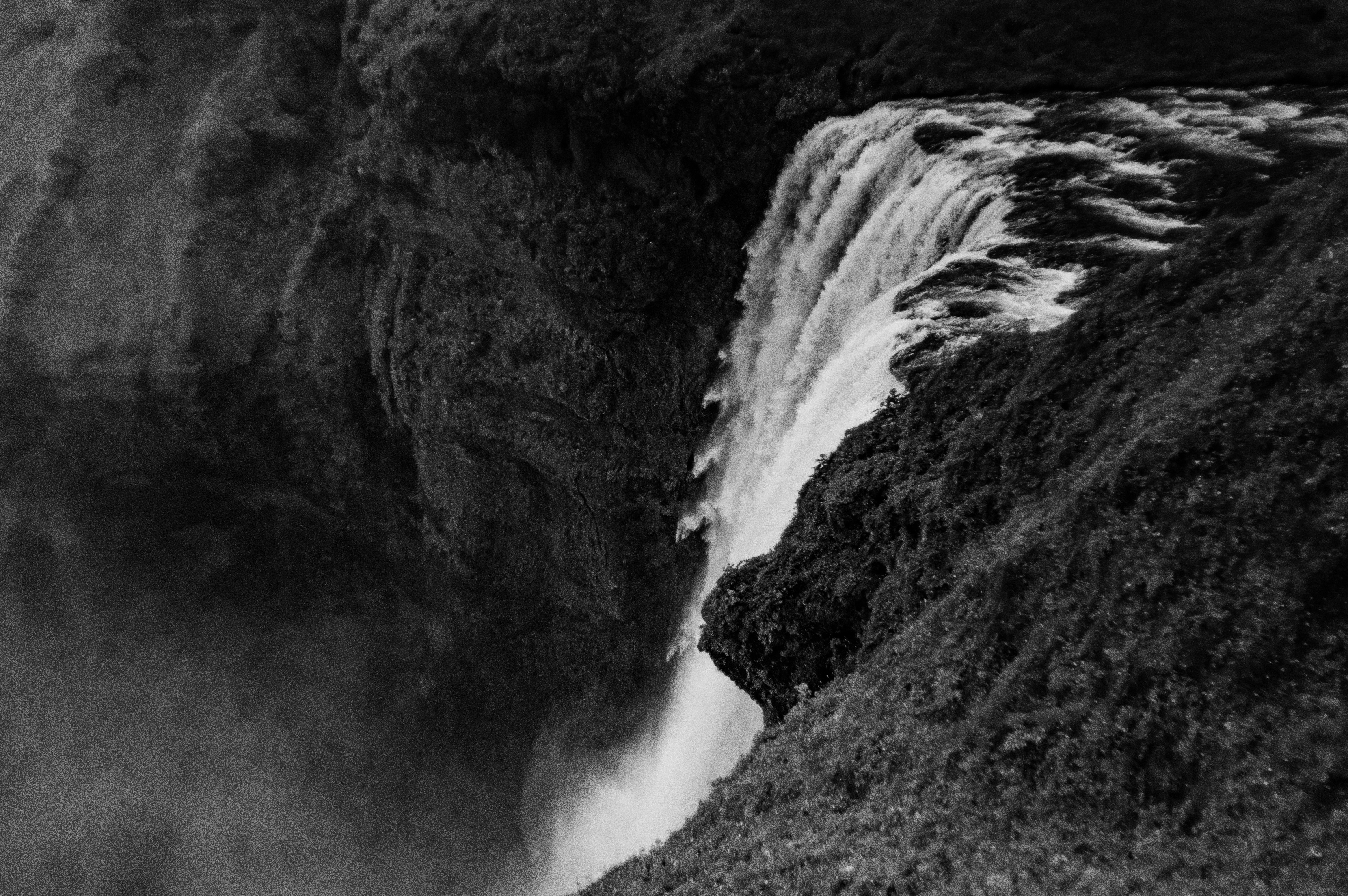 gray scale photo of waterfalls